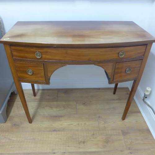 576 - A 19th century mahogany bow front desk/dressing table with three drawers - Width 100cm x Height 83cm