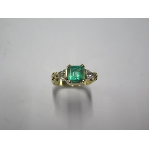 72 - An 18ct yellow gold emerald and trillion cut diamond ring - emerald approx 1.5ct, emerald is a good ... 