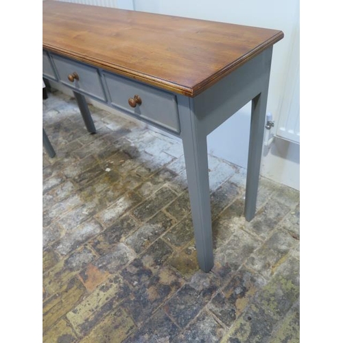 667 - A new painted four drawer hall table with a polished pine top made by a local craftsman to a high st... 