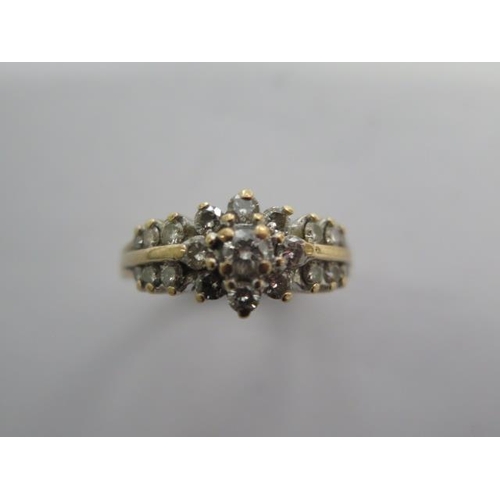 102 - A hallmarked 9ct yellow gold diamond cluster ring size N - approx weight 5 grams - in good condition