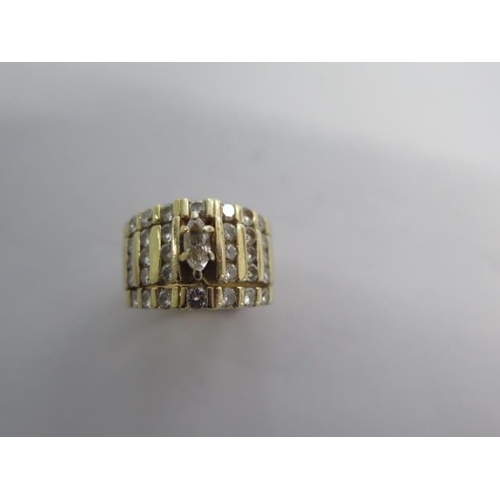 103 - A yellow gold diamond ring size K - 12mm tall - approx weight 8.2 grams - surface tests to approx 18... 