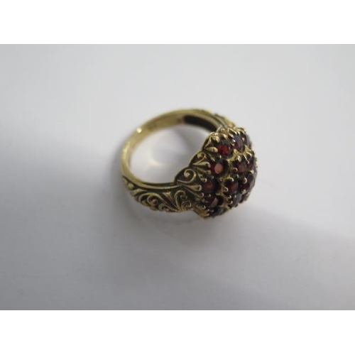 104 - A hallmarked 9ct yellow gold garnet ring size M/N - approx weight 6.6 grams - generally good conditi... 