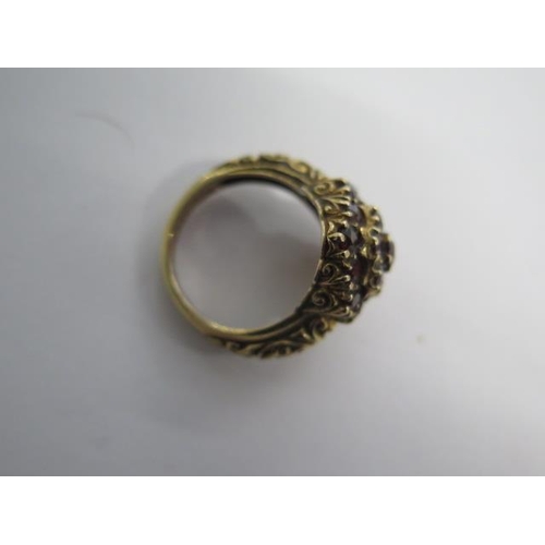 104 - A hallmarked 9ct yellow gold garnet ring size M/N - approx weight 6.6 grams - generally good conditi... 