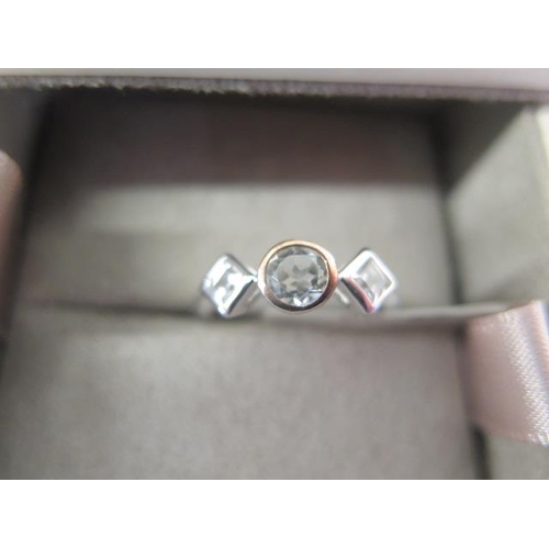 115 - A Clogau silver white topaz three stone ring size M, a Clogau silver Welsh Dragon signet ring size O... 