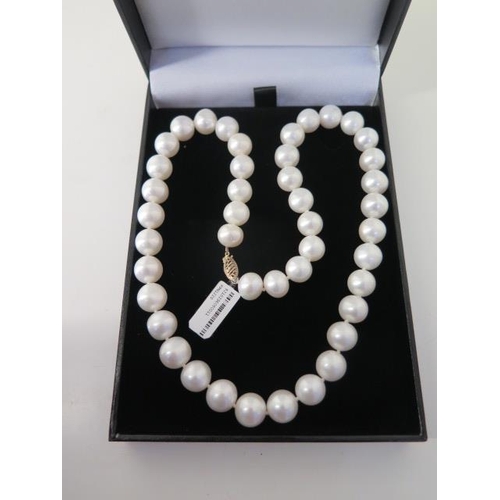 118 - A one strand white pearl necklace - Length 51cm - pearls approx 10mm - ex jewellers stock in as new ... 