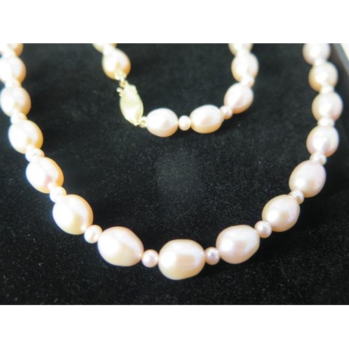 120 - A one strand pink freshwater pearl necklace with 9ct clasp - Length 43cm - pearls approx 7mm x 8mm -... 