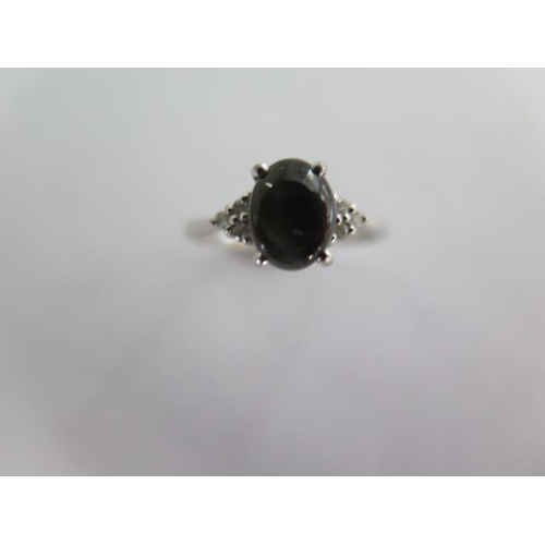 124 - A 9k black star sapphire and diamond white gold ring size R - approx weight 2 grams - almost unworn ... 