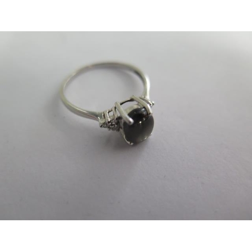 124 - A 9k black star sapphire and diamond white gold ring size R - approx weight 2 grams - almost unworn ... 