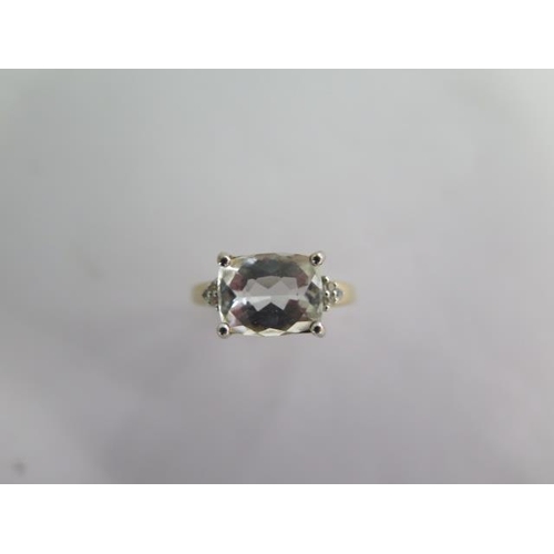 125 - A 9k Goshenite and white sapphire yellow gold ring size R - approx weight 3.5 grams - almost unworn ... 