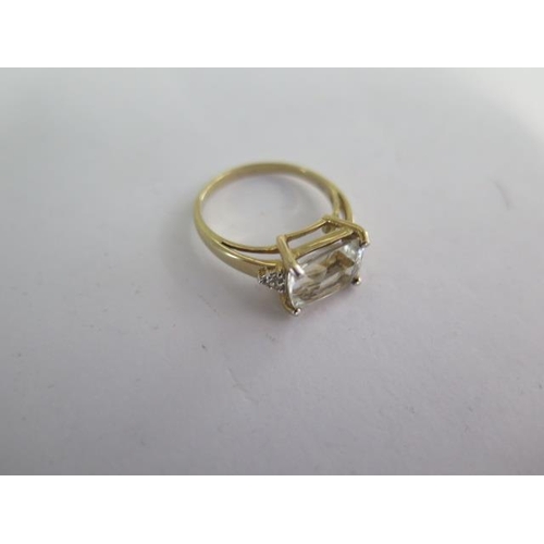 125 - A 9k Goshenite and white sapphire yellow gold ring size R - approx weight 3.5 grams - almost unworn ... 