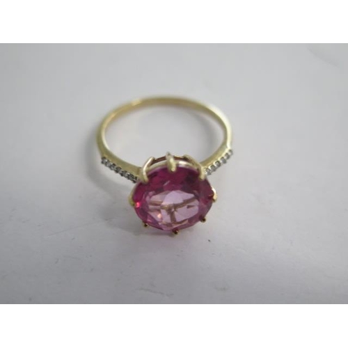 129 - A 9k flamingo topaz and diamond yellow gold ring size N - approx weight 2 grams - almost unworn cond... 