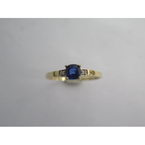 133 - A 9k Tanzanite and diamond yellow gold ring size R/S -approx weight 1.2 grams - almost unworn condit... 