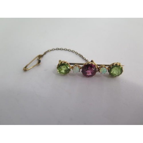 139 - A yellow gold amethyst, peridot and opal brooch - Length 35cm - weight approx 3.4 grams