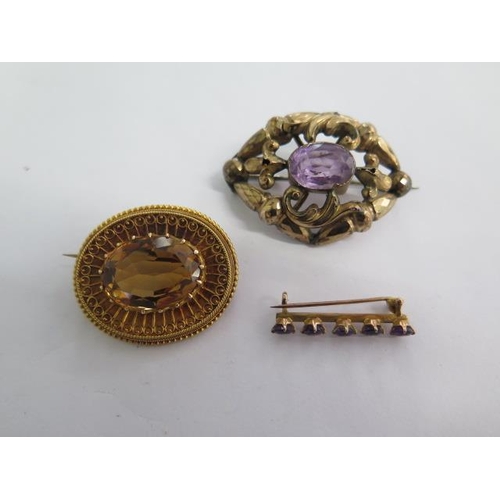 140 - Three gilt metal brooches - largest 8mm - total approx weight 19 grams - wear to amethyst reposse br... 