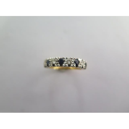 142 - An 18ct yellow gold diamond and sapphire ring size P - approx weight 5.6 grams - in good condition