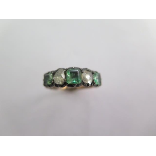 142A - An old cut five stone emerald and diamond yellow metal ring possibly 19th century - centre stone app... 