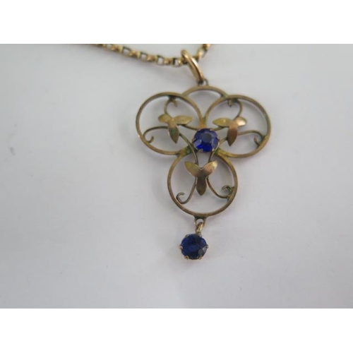 143 - A gilt metal pendant on a 9ct chain and three 9ct brooches - total approx weight 14 grams