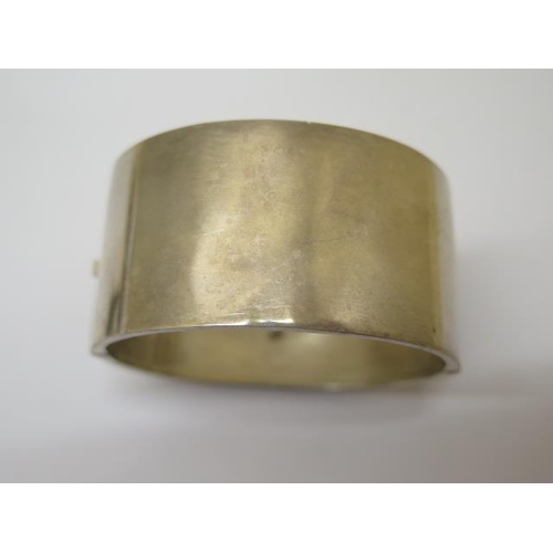 149 - A silver bangle - 6cm x 5cm x 3cm external - a silver page marker and a silver pocket watch on a cha... 