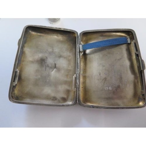 152 - A dented silver cigarette case and a silver thimble - approx total weight 2.2 troy oz