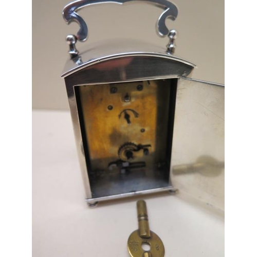 154A - A silver plated Liberty Carriage clock with a blue and white enamel dial - Height 13cm with handle u... 