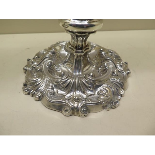 159 - A pair of ornate embossed weighted silver candlesticks - Height 28cm - Sheffield Waterhouse Hodson &... 