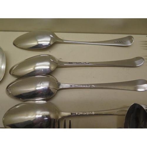 191 - A collection of assorted silver flatware forks and spoons and a pair of nips including four GA forks... 