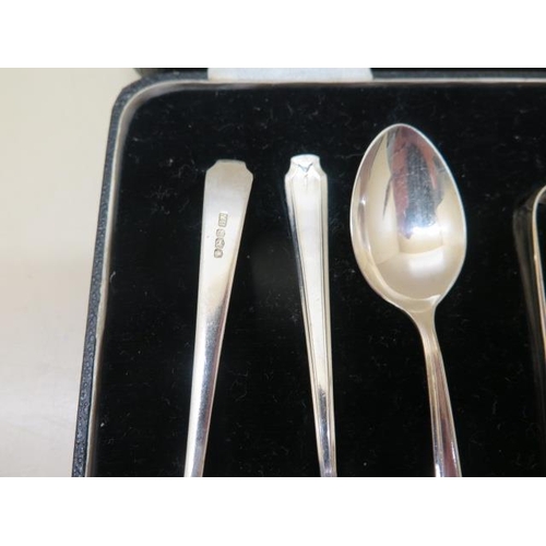 197 - A boxed set of silver tea spoons and a nip, a pair of silver table spoons, two other sets of four si... 