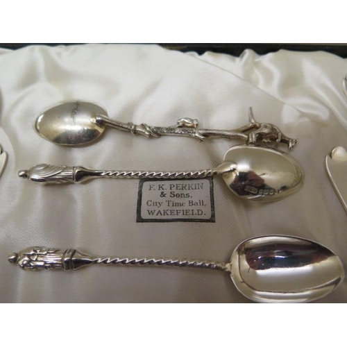 197 - A boxed set of silver tea spoons and a nip, a pair of silver table spoons, two other sets of four si... 