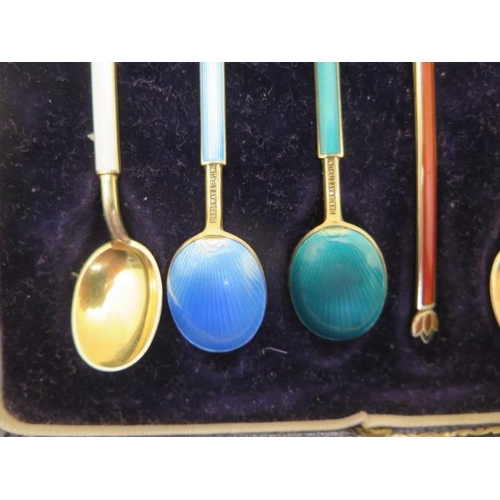 198 - A boxed set of six silver enamel coffee spoons marked DA NORWAY STERLING - Two have small enamel los... 