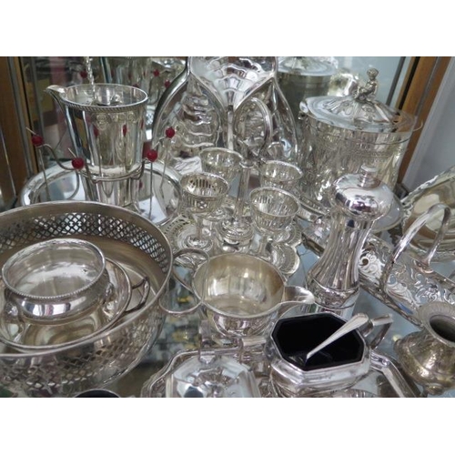 200 - An interesting collection of silver plated items including a biscuit barrel, four piece tea set etc