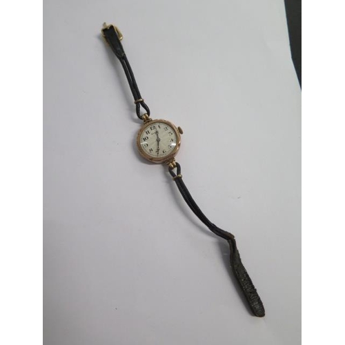 236 - A 9ct yellow gold Rolex manual wind ladies wristwatch on a leather strap - 24mm case - not running -... 