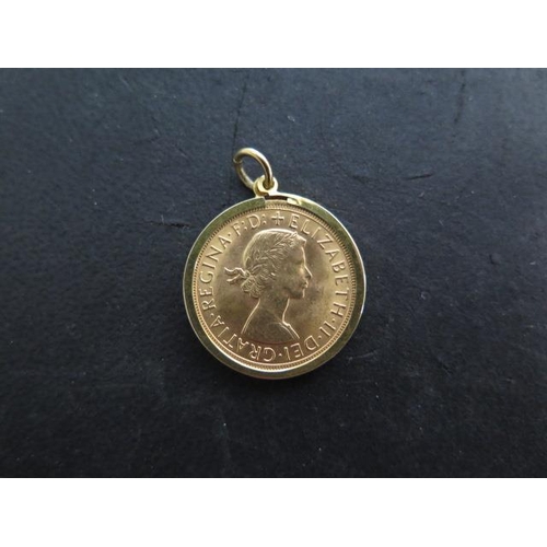 248 - An Elizabeth II full gold sovereign dated 1965 in a 9ct gold mount - approx weight 9.2 grams