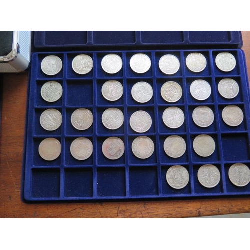 249 - A collection of British and World coins in five trays in a metal carry case