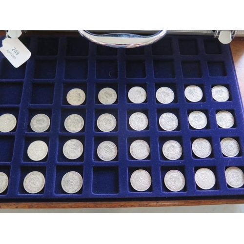 249 - A collection of British and World coins in five trays in a metal carry case