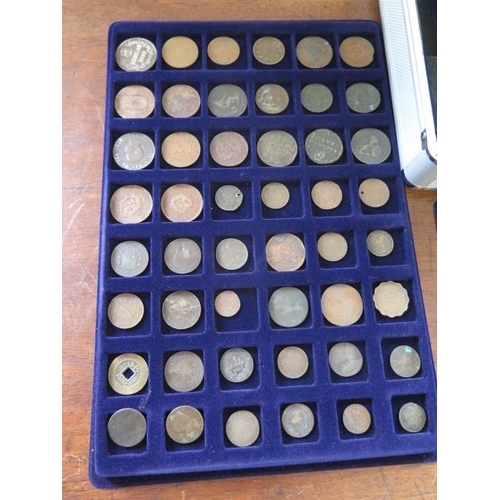 249 - A collection of British and World coins in five trays in a metal carry case