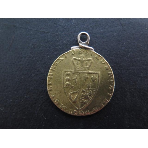 263 - A 1704 George III gold Guinea coin with a soldered mount - approx weight 8.5 grams