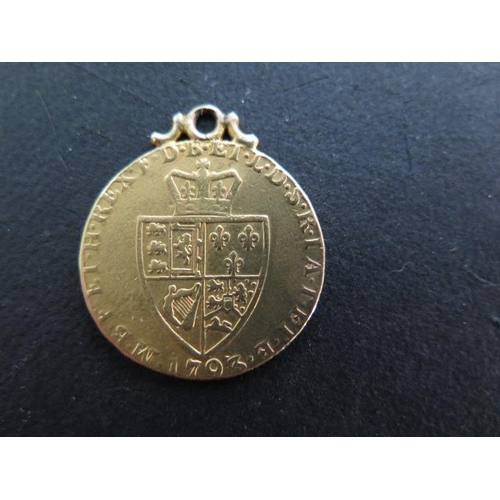 265 - A George III gold Guinea coin dated 1793 with a soldered mount - approx weight 8.4 grams