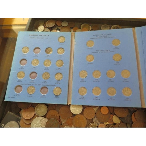 266 - A collection of loose World coinage and three folders, and an album including some bank notes