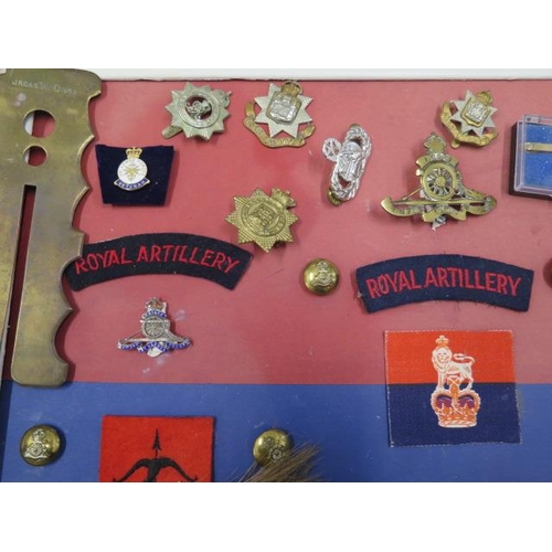 299 - A collection of Militaria - badges, belts etc