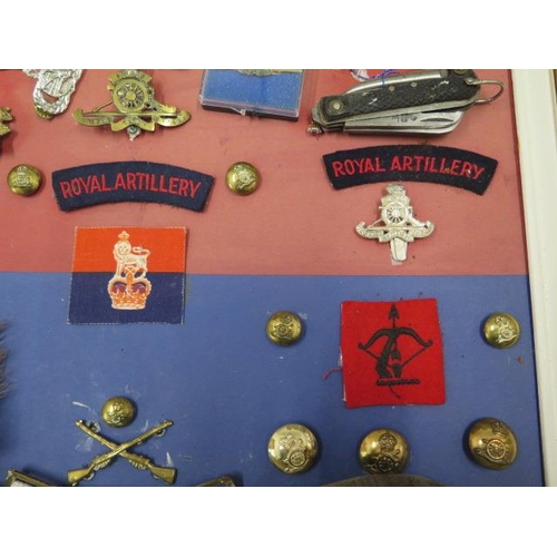 299 - A collection of Militaria - badges, belts etc