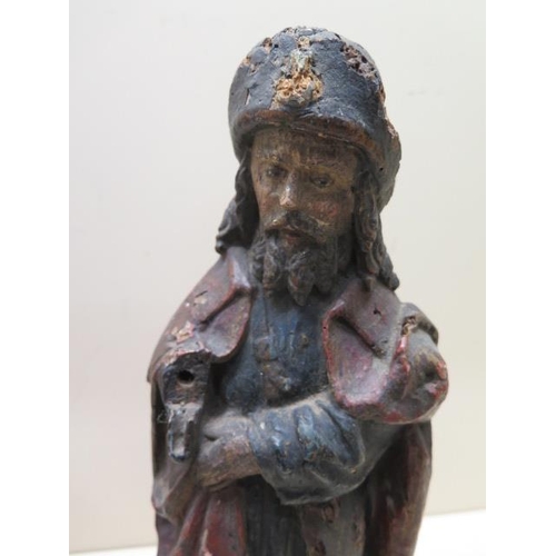 314 - A polychrome decorated carved wood Religious figure - Height 35cm - some losses and signs of worm co... 