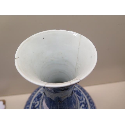 319 - An antique Chinese blue and white vase with old staple repairs to the neck - Height 40cm