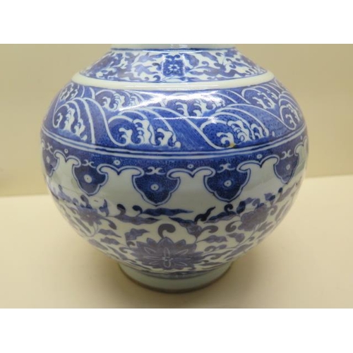 319 - An antique Chinese blue and white vase with old staple repairs to the neck - Height 40cm