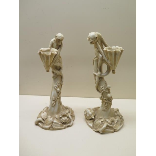 A pair of Royal Worcester ivory blush monkey candlesticks - Height 27cm - numbered 1140 - both good condition