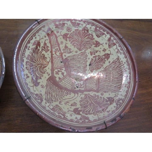 332 - Two Hispano-Moresque ware lustre bowls - 32cm and 40cm diameter - both with old riveted repairs