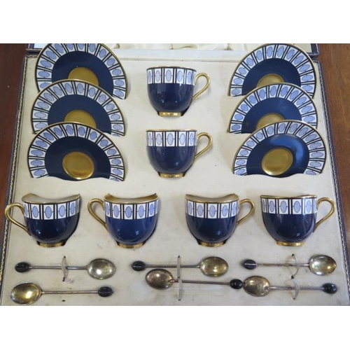 333 - A Royal Worcester blue six setting coffee set with silver coffee bean spoons in a Mappin and Webb pr... 