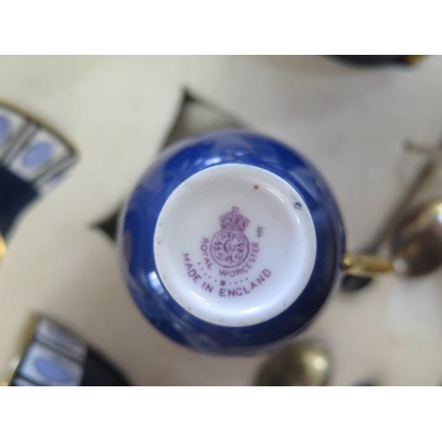 333 - A Royal Worcester blue six setting coffee set with silver coffee bean spoons in a Mappin and Webb pr... 