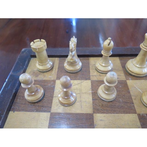 334 - A boxwood and ebonised weighted chess set with board, King approx 8cm - some wear to black pieces ot... 