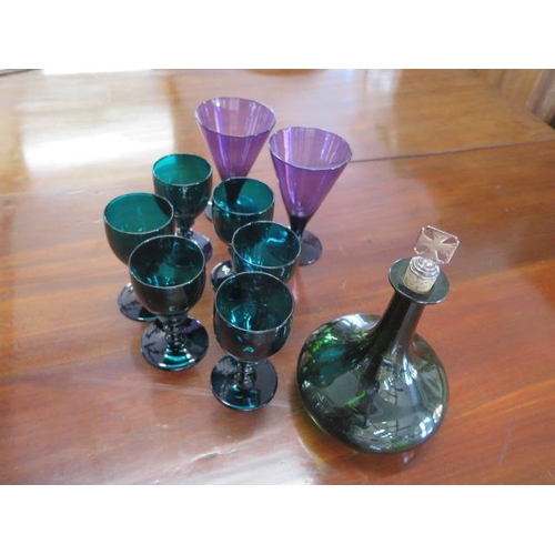 336 - Six green glass goblets - Height 13cm - a green glass decanter with silver cross cork and a pair of ... 