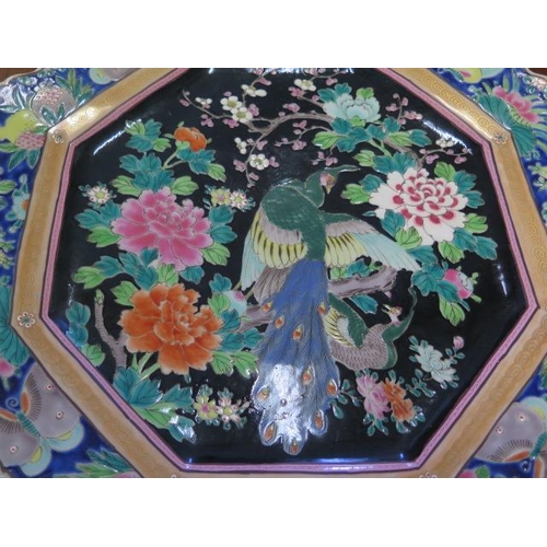 339 - A large bird decorated Oriental octagonal plate - Width 43cm - small chips to rim otherwise good